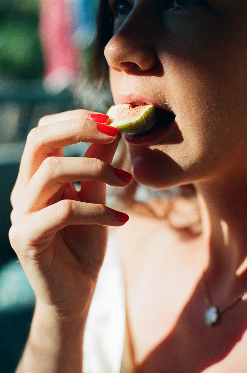 woman eating a lime