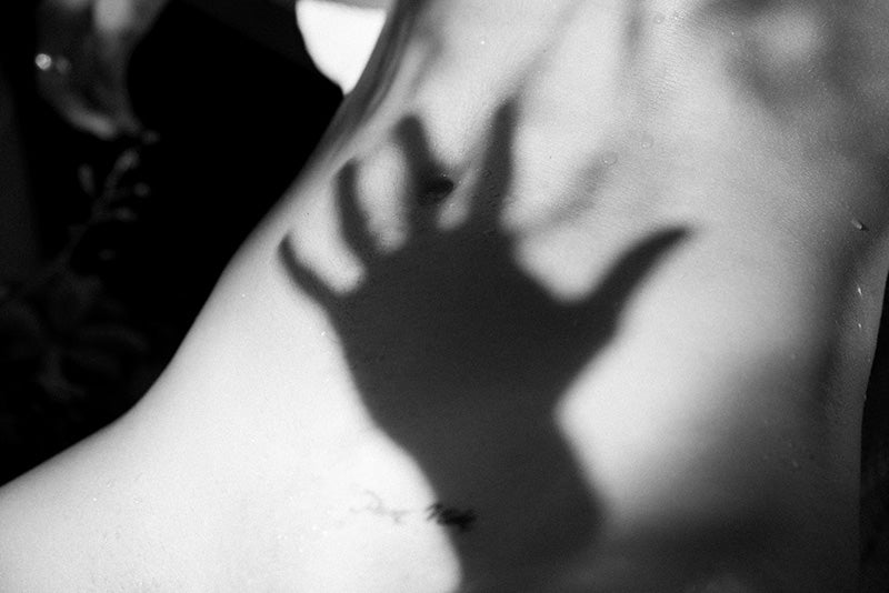 shadow of hand on body