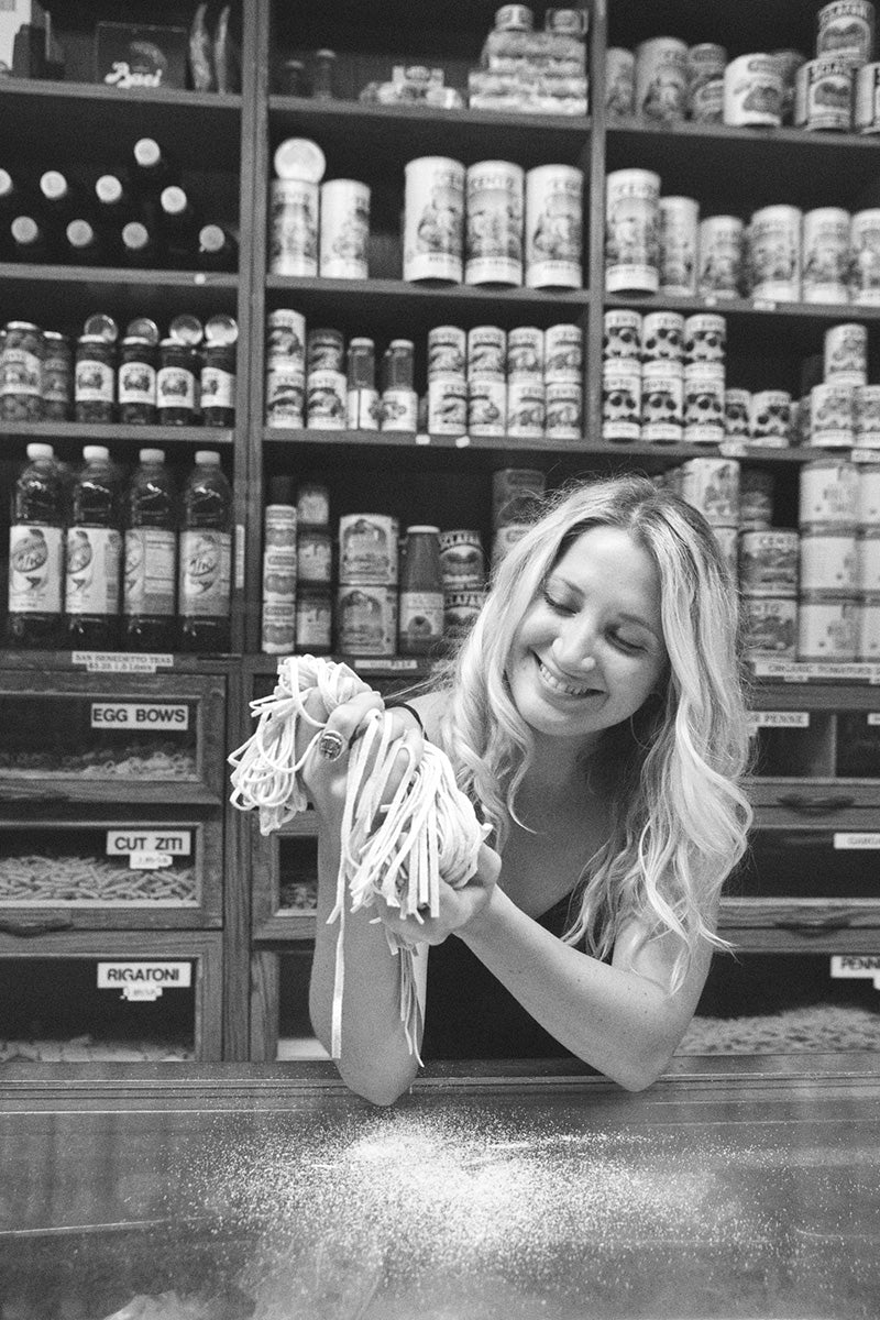 woman at store with pasta