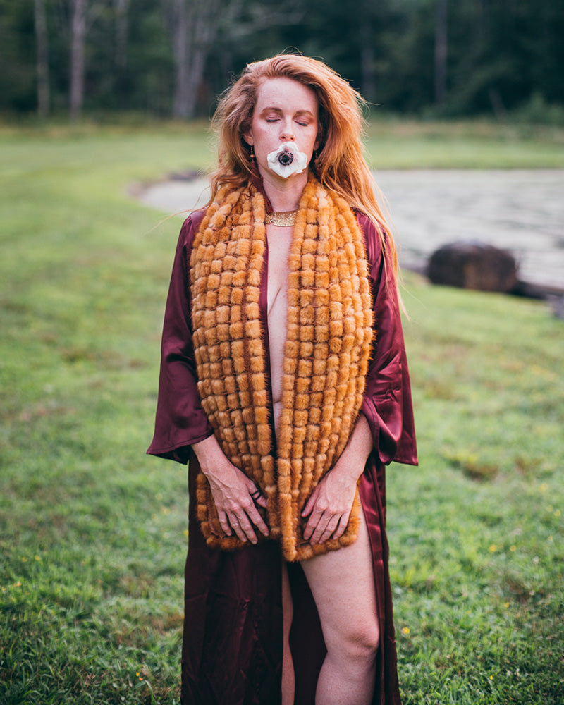 woman with flower in mouth