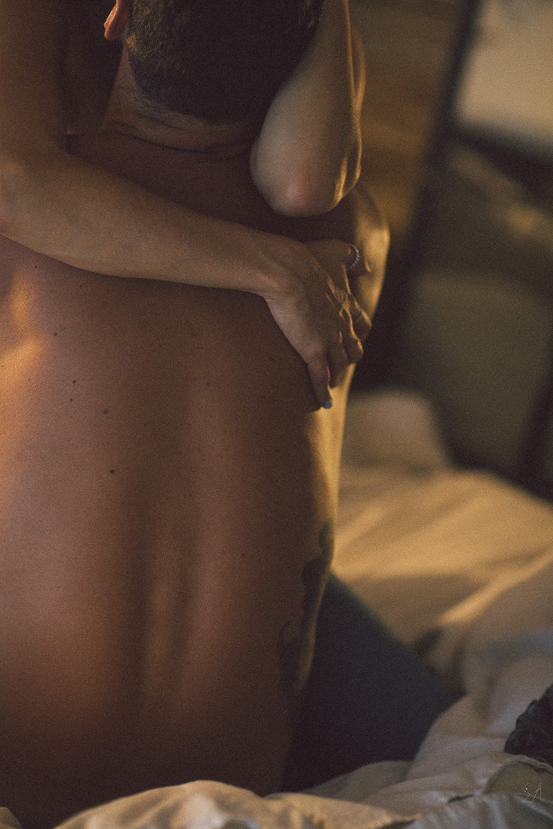 woman and man being intimate in bed