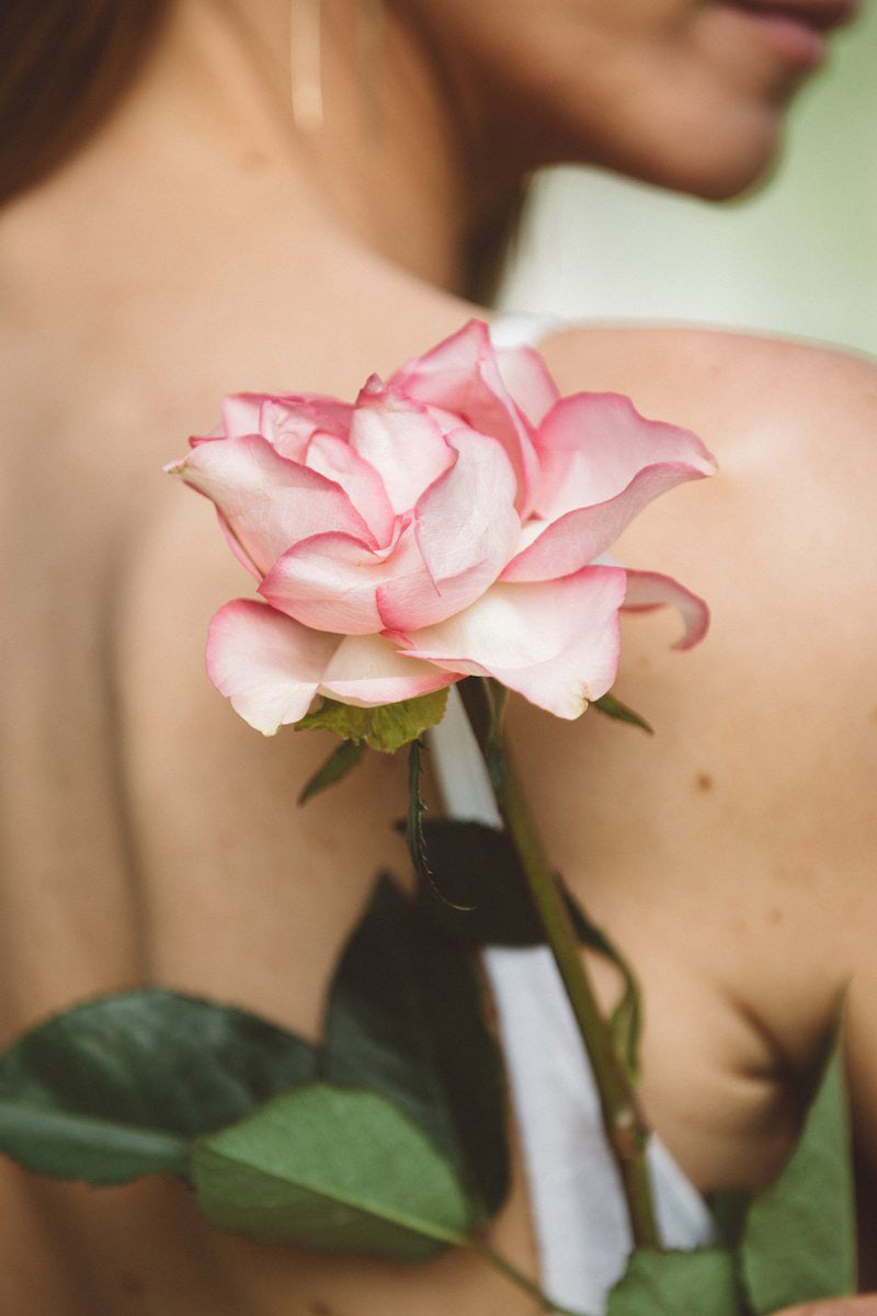 woman with flower on back