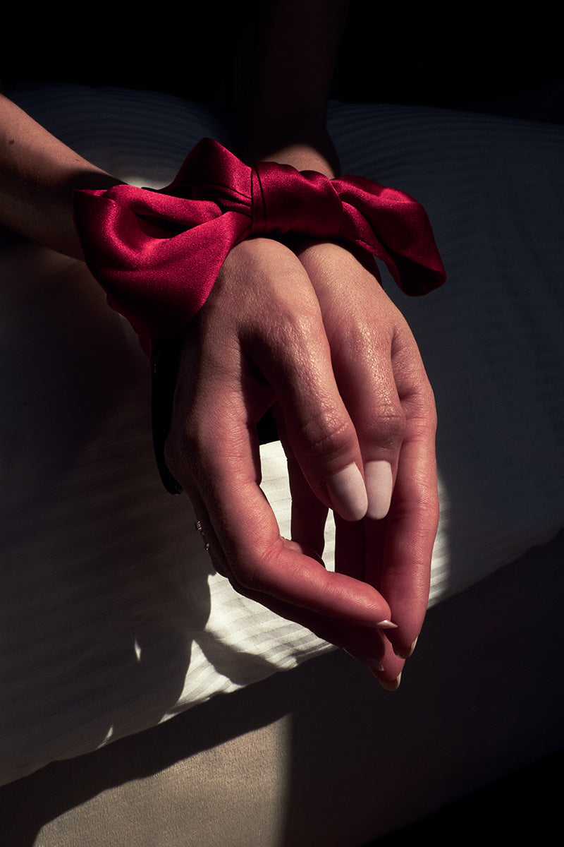 red bow around hands