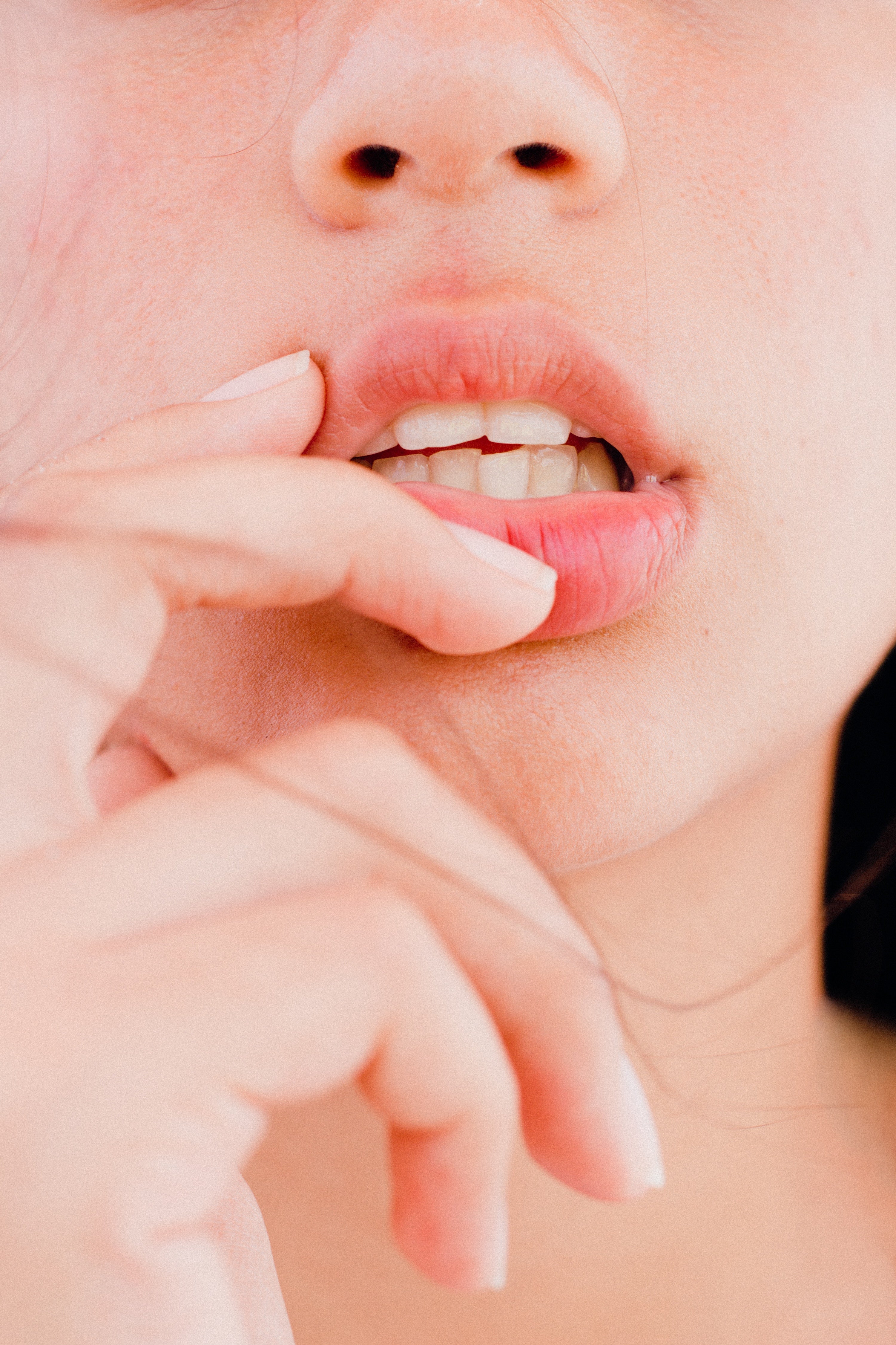 woman touching her lips
